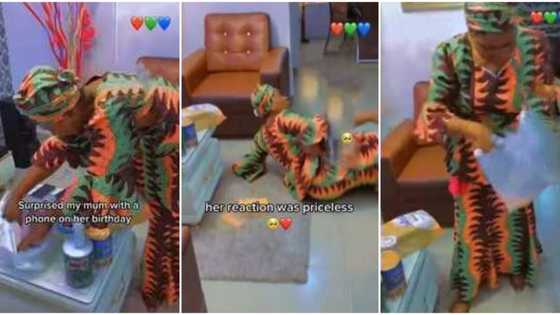 Priceless moment well-dressed Nigerian mum rolled on the floor in joy after son surprised her with new phone
