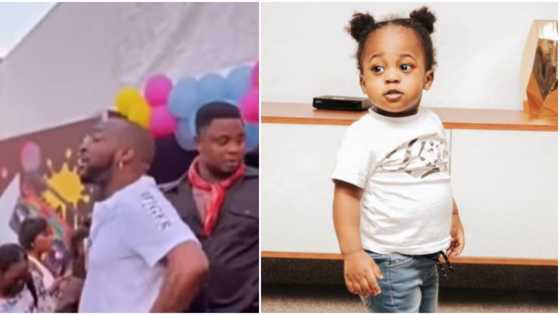 Video shows Davido breathing hard as he struggles to get Ifeanyi to stay in one place at a party