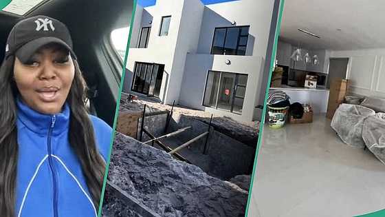 Lady who grew up with no family celebrates building mansion with her man and child, video melts hearts