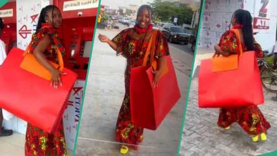 Drama as Nigerian girl is captured on the road with gigantic red bag, video goes viral