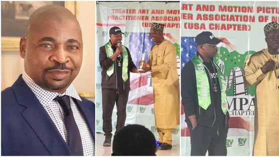 MC Oluomo bags merit award in the US, spotted with TAMPAN president Mr Latin, video & pics spark reactions