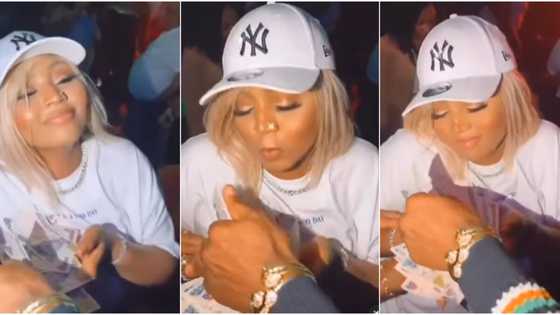 "Thunder fire poverty": Reactions as Regina Daniels' mum, brother spray her money at her 22nd birthday party