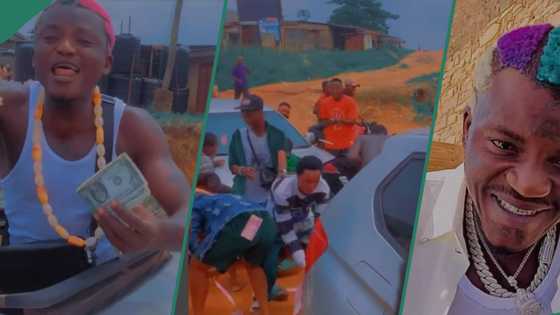 Portable Zazu throws dollars, naira in the air as he gives back to the trenches after Europe tour