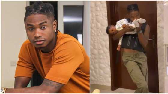 "E no get choice again": Baby resigns to fate as Lil Kesh uses him as action game props in hilarious video