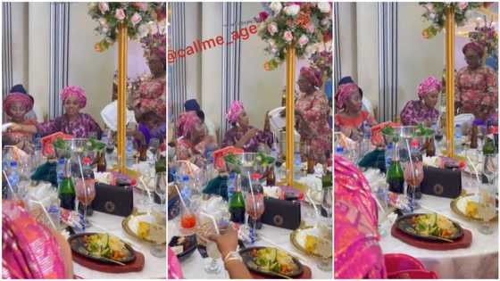 Dramatic moment at party as woman drags souvenirs, shares them to people around her