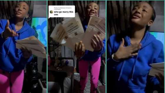 "They said nobody will ever marry me": Nigerian lady dances and flaunts wedding invitation card