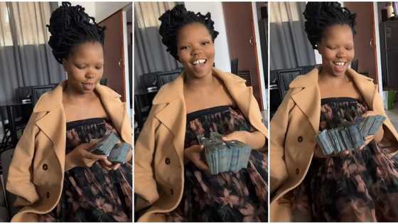 "Don't go back to your poor boyfriend": Sugar daddy warns young lady, spoils her with bundles of cash in video
