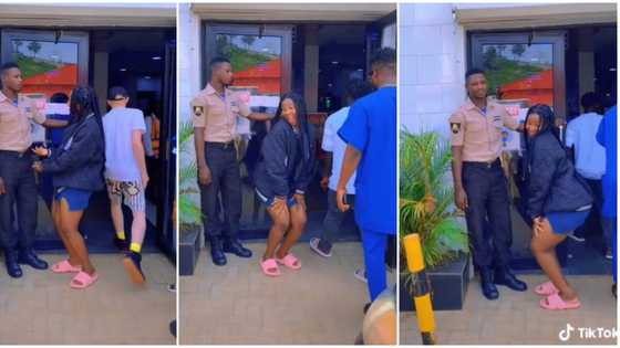 "What a shy guy": Security man keeps his cool as pretty Nigerian lady whines waist for him in funny video