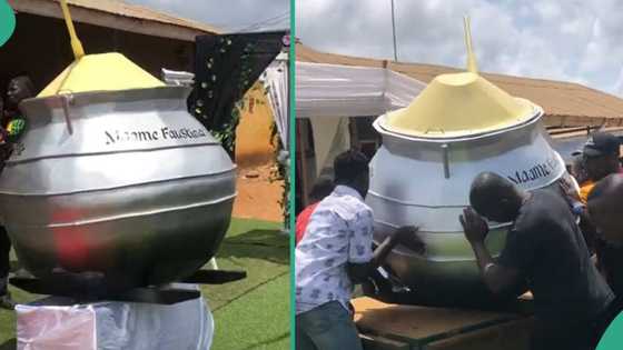 Food seller from Ghana buried inside fantasy coffin that looks like iron pot after she passed on