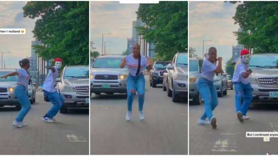 "How did you stop the traffic?": Nigerians react as young lady dances in Lagos traffic, man joins her in video