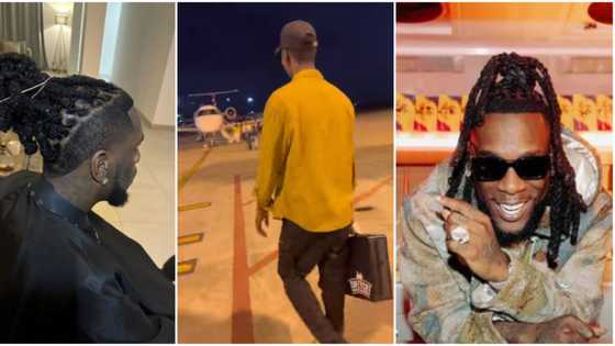 “Odogwu no be guy name”: Burna Boy flies out barber to trim his hair in video, Nigerians praise man’s talent