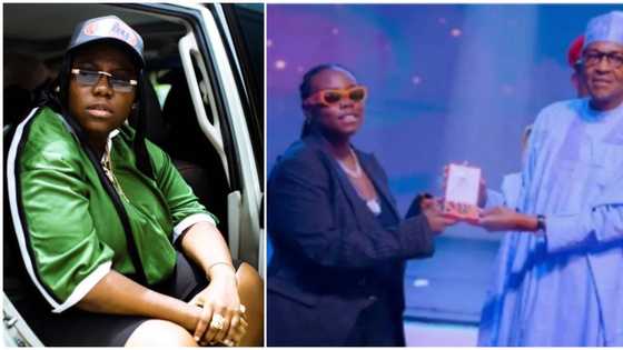 "Na to go back go sleep": Teni reacts amid backlash for 'boning face' at Buhari during award acceptance