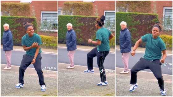 Black lady dances on the street, wows oyinbo woman with her moves, she stops & keeps looking