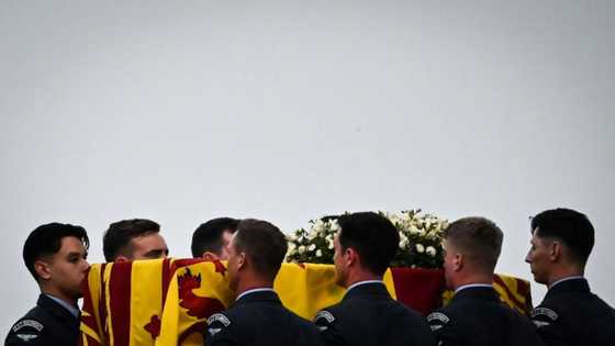 Crowds gather as queen's coffin to go on display in London