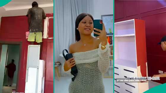 Lady cries out after using red paint on her bedroom wall, shelf and dining table, seeks help