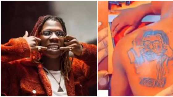 "E be like masquerade for Soso video": Reactions as diehard fan tattoo’s singer Seyi Vibez on his back