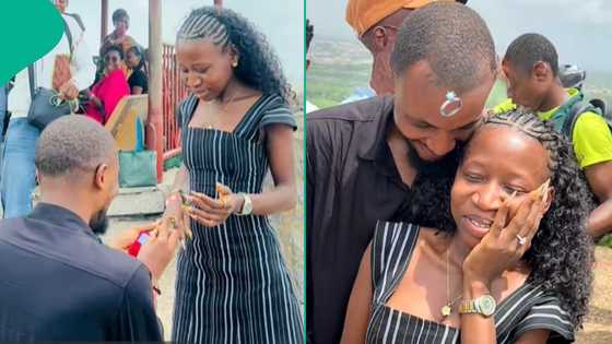 Man draws massive attention after he proposed to his girlfriend of 10 years on Olumo Rock