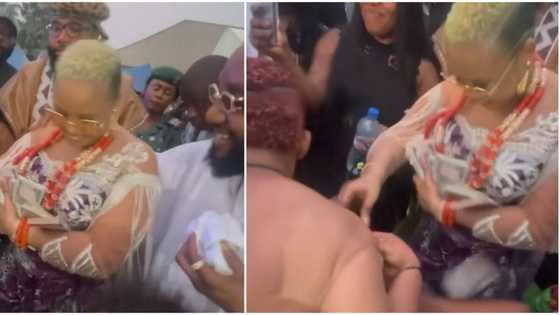 Thunder fire poverty: Reactions as E-Money's wife sprays Kcee's woman with bundles of money on dancefloor