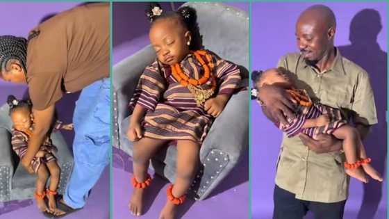 "Snap her like that": Reactions as baby sleeps off on chair during photo shoot, funny video trends