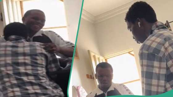 Nigerian man gifts his younger brother new phone, he kneels down to show gratitude