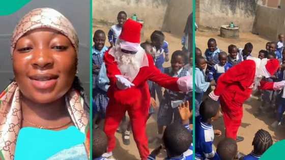 Lady rocks Father Christmas costume at mum's school to hype kids for party