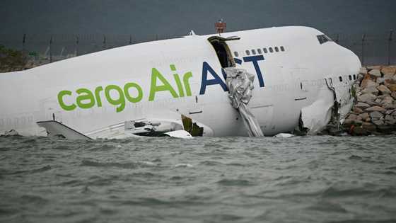 Cargo plane skids off Hong Kong runway, kills two