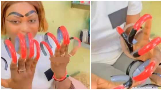 Lady sports extra long spiral nails in viral video, netizens have questions: "But why?"