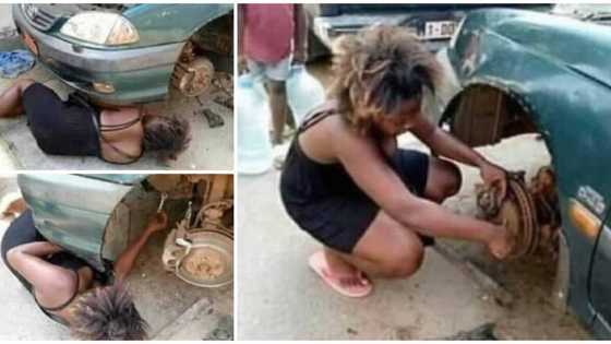 Lady gets down to fix car herself after it developed fault on the road, photos cause massive stir