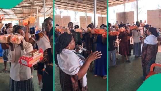 Prophetess shares video of church members holding loaves of bread and cans of sardines