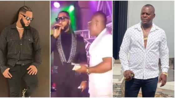 He's protecting his glory: Video shows moment Flavour dodged rich colleague trying to spray money on his head