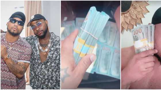 Davido's cousin B-Red kicks off birthday in advance, shows off several bundles of dollars