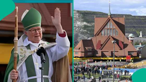 Engineers uproot 113 year old church in Kiruna Sweden, drive it to another location using trucks