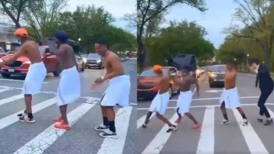 Nigerian man and dancer friends wearing towels and dancing on street in Washington DC celebrated in US, others