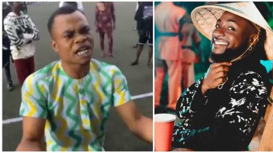 Videos of Davido smoking on football pitch as excited fan sings for him