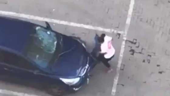 Angry lady destroys boyfriend's car with her hands, social media reacts as video goes viral