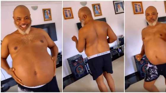 Shirtless man with pot belly dances to Kizz Daniel's Pour Me Water with great energy, whines waist in video