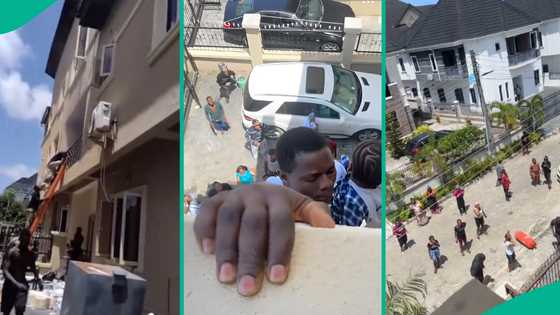Video: Man heroically holds baby while hanging from balcony of building engulfed by fire in Lagos