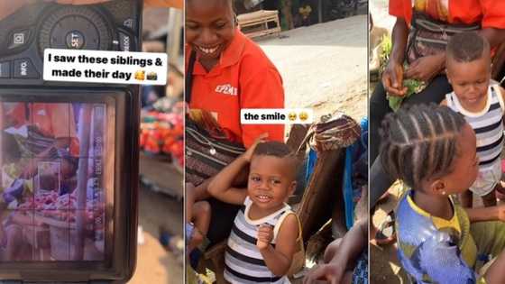 Nigerian photographer secretly takes photo of market woman and her children, shows them in viral video