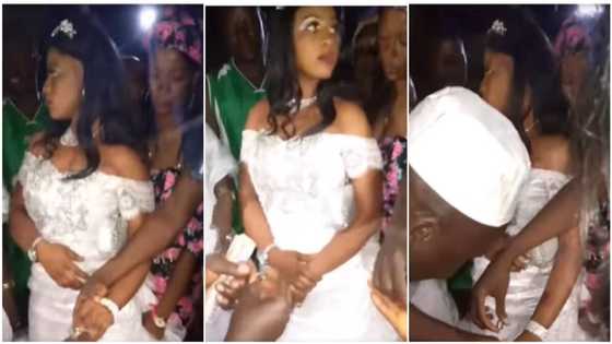 "Do you want or not?" Angry bride looks away from camera as groom puts many rings on her fingers