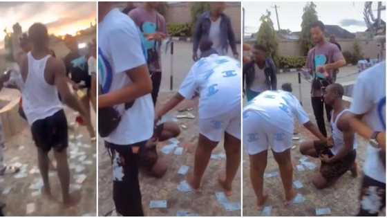 Nigerian man's friends spray only N50 notes on lady as she accepts his proposal, video causes stir