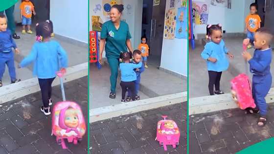 Little boy melts hearts as he hugs and helps his classmate carry her bag on first day of school