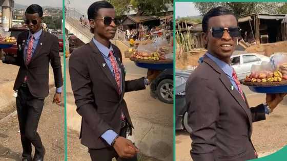 "My eyes have seen wonders in Abuja": Lady shares video of unique kola nut hawker dressed in suit