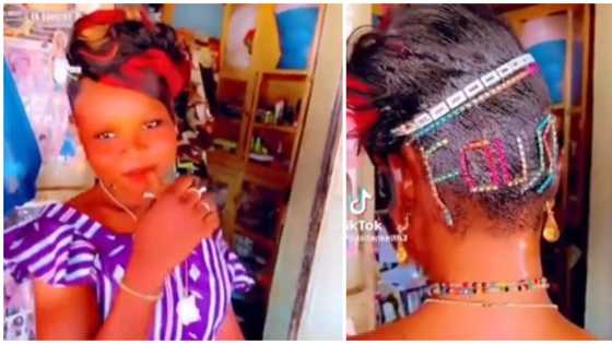 Nigerians react as young girl bedazzles hair with her name in trending video