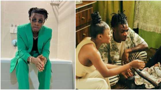 "Is our Joeboy now a daddy?" Singer sparks speculations as he shares photo of woman and baby