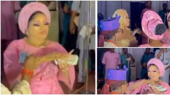 He will collect the money back: Nigerians react as Bobrisky lavishly sprays bundles of cash at an event