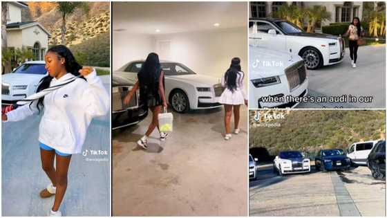 Pretty lady from rich home shows people many Rolls Royce cars with custom features in her parents' house