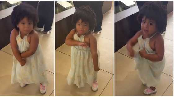 Fine baby girl in floral gown and afro hair dances accurately in public, shakes body in sweet video