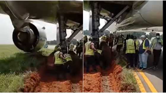 Plane gets stuck in the mud while preparing to take off, video shows officials using shovel to clear it