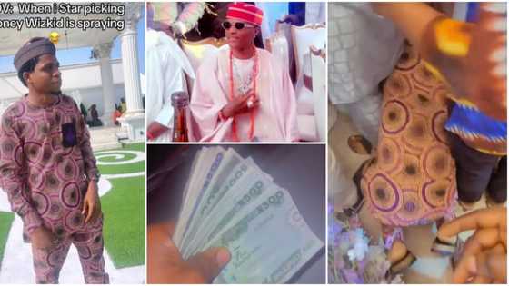 "Don't dull”: Video as man shamelessly kneels down to pick money sprayed at Wizkid's mum's burial