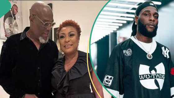 "A whole odogwu": Reactions as Burna Boy's dad gives him brain resetting slap at mum's birthday